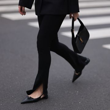 victoria thomas seen wearing jacquemus black cut out blazer, hm black slit pants, zara black leather kitten heels, saint laurent black leather bag on march 20, 2023 in cologne, germany photo by jeremy moellergetty images
