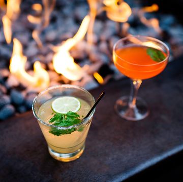 two cocktails by restaurant open fire